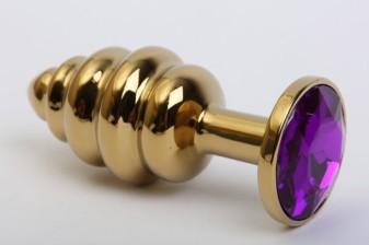 Золотистая ребристая анальная пробка с фиолетовым стразом - 7,3 см., фиолетовый